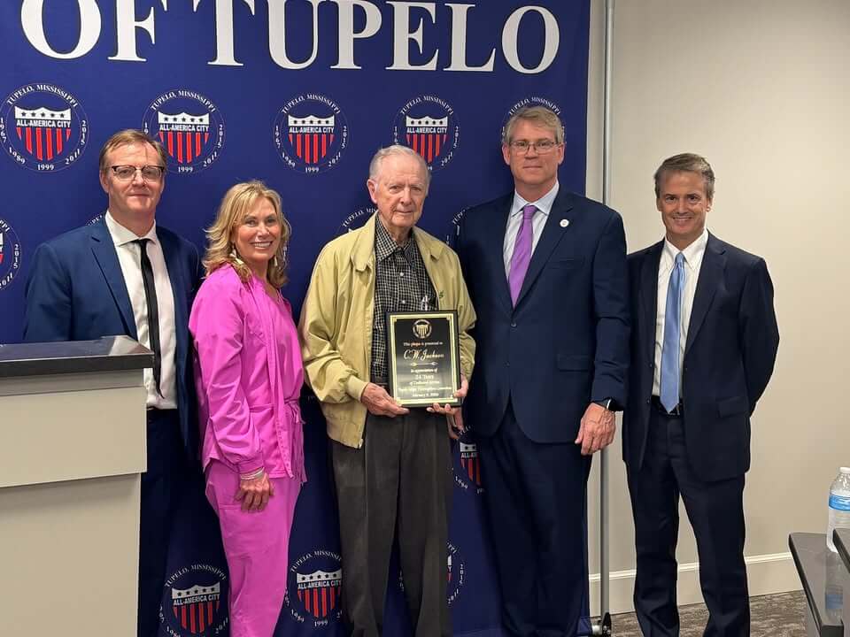 C.W. Jackson (center) was recognized at Tuesday night's Tupelo City Council meeting for his 24 years